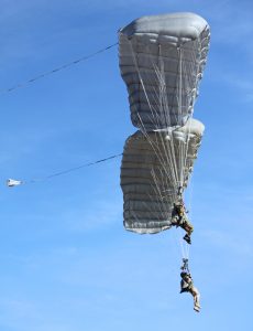 Airborne Systems - MMS Multi-mission Army Ram Air Parachute system for military special forces jumpers. Carries 450-485 lbs. Max deployment altitude 25,000 ft. 2 jumpers side by side deployed canopies.
