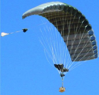 Airborne Systems FireFly Army Cargo Delivery Parachute System. JPADS 2K System of Choice. Carries unmanned loads up to 2,200 lbs. Max deployment altitude 24,500 ft. drop Deployed canopy from below with blue sky.