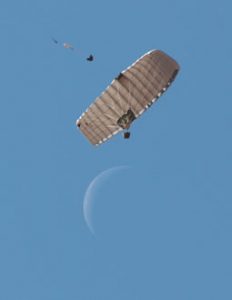 Airborne Systems FireFly Army Cargo Delivery Parachute System. JPADS 2K System of Choice. Carries unmanned loads up to 2,200 lbs. Max deployment altitude 24,500 ft. drop from below. Waxing / crescent moon.