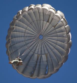 Airborne Systems. Canopy from below. MC-6 Army Troop Parachute non-steerable for military jumpers. Low opening. Carries up to 400 lbs. Minimum deployment altitude 500 ft. Military & space textile manufacturing & design. Army & space parachute canopies, aerial delivery (GPADS/JPADS). Aircraft & spacecraft deceleration systems.