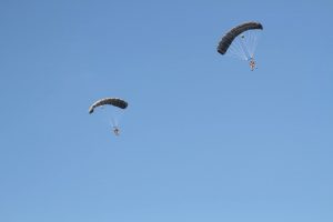 Airborne Systems - Intruder RA-1 Army Ram Air Parachute system for military special forces and beginner jumpers. Carries 450 lbs. Max deployment altitude 25,000 ft. 2 jumpers blue sky. Fort Bragg 2016.